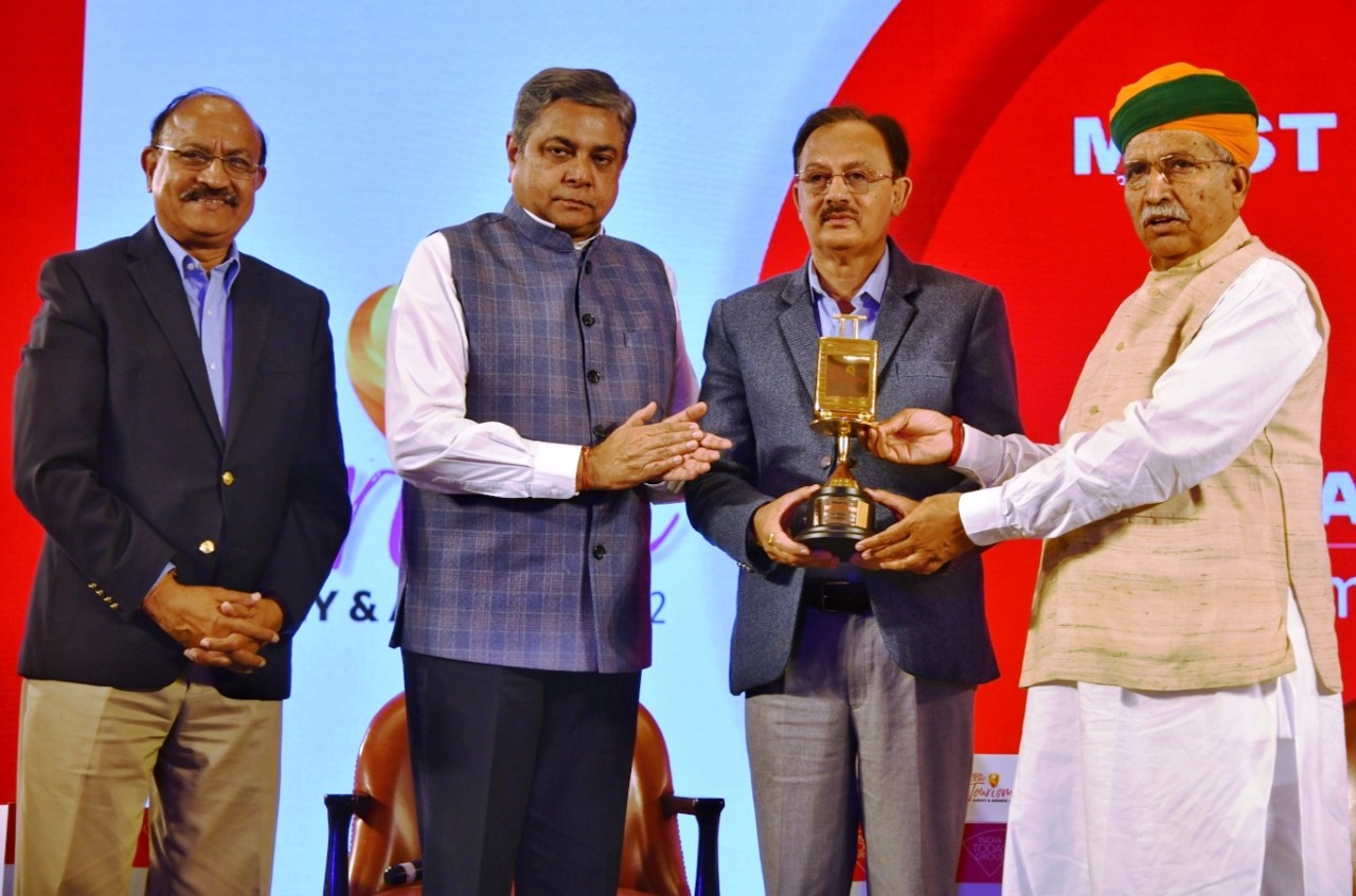 Industry Minister receiving award